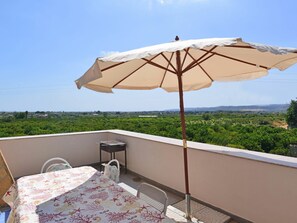 Sky, Furniture, Umbrella, Plant, Shade, Table, Water, Outdoor Furniture, Interior Design, Tree