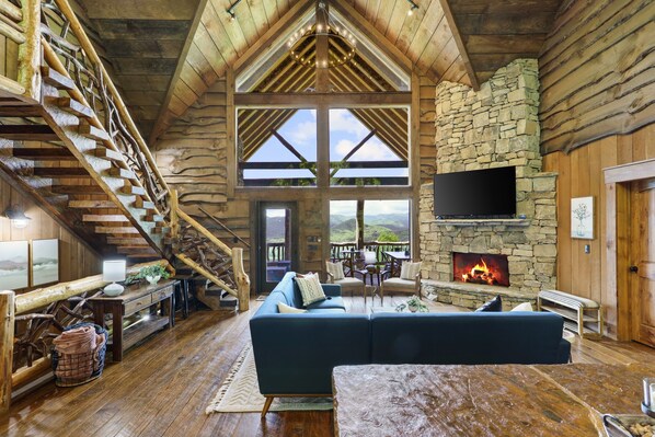 large, open living room and kitchen with great mountain views