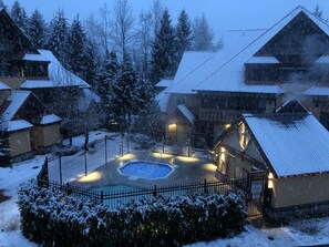 A snowy courtyard setting view from one of two balconies.