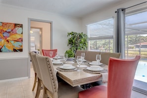 Formal Dinner Seating for 8 facing the lanai (kids table in the corner)