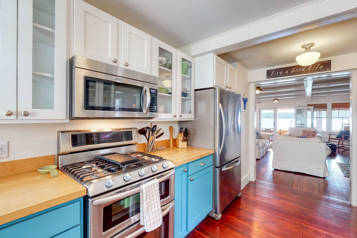 Lakefront home with private dock, kayaks, firepit, grill, & sunroom