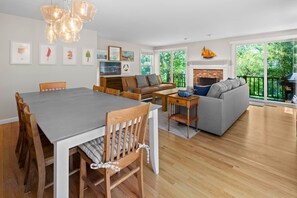 Living room (1st floor). TV, 2 sofas, dining table and chairs for 8 people.