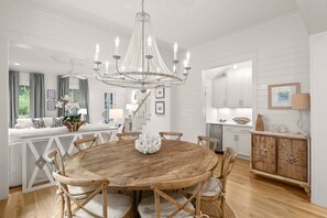 Stately dining area under chandelier lighting