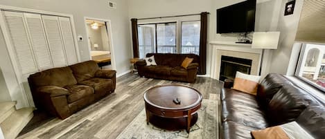 Family room with sleeper sofa and 55" smart TV