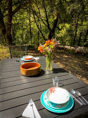 We put out fresh cut flowers each day from our garden.  Dining ware provided