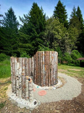 We built the funnest spiral outdoor shower surrounded by Redwood trees.