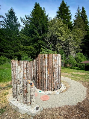 We built the funnest spiral outdoor shower surrounded by Redwood trees.