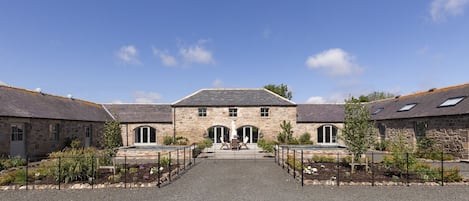 The Steading at West Lyham - large south-facing courtyard with two large water features