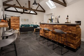 The Steading at West Lyham - TV and bar room with stool seating, large TV and corner sofa (beer pumps not available for guest use)