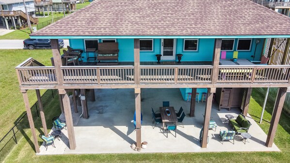 Main floor Deck with ample seating to enjoy Ocean Breeze, sound and views.