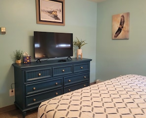 Bedroom 2 w/ refinished dresser and new TV.