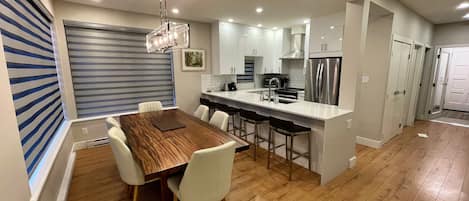 View from living room into Dining room and open concept kitchen