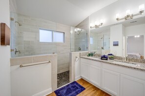 Master bathroom boasts a double shower and double vanity sink.