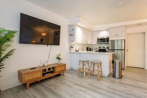 Coastal Themed living room with a 65" Smart TV.