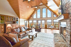 Massive great room, with floor to ceiling windows to enjoy the view.