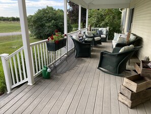 Lovely covered front porch to catch the sunrise