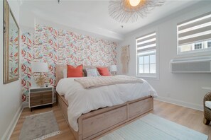 Salina wallpaper by Manual Canovas with koi fish in a coral reef.  Dream mattress and bed by Pottery Barn. 