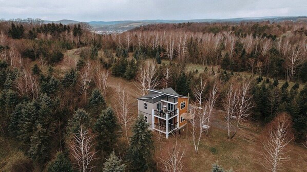 This private Chalet lies on 60 acres of explorable woods and farmland.