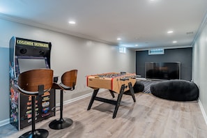 Entertainment room with 86" TV in the basement
