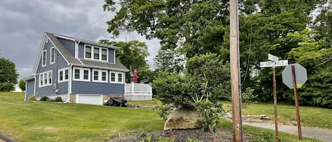 Located on corner, property includes a large well yard for your enjoyment.