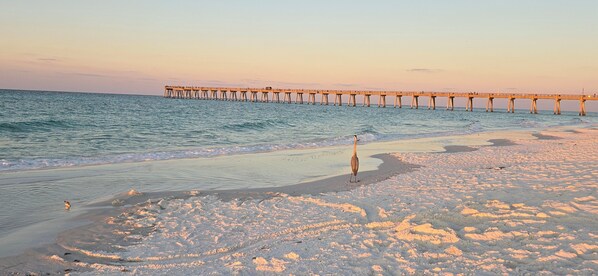 Sunset serenity on Navarre Beach,3 minutes from your stay. Pure coastal bliss!