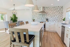 Beautifully remodeled kitchen featuring  Wine chiller. 