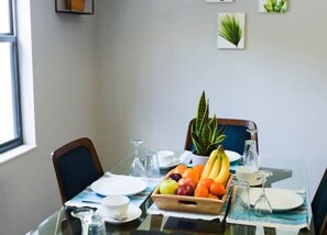 Well-lit dining room, the perfect place to enjoy a great meal.