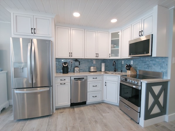 Kitchen with granite countertops and stainless steel appliances.