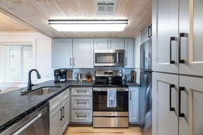 Features all stainless steel appliances and is fully stocked with all kitchen essentials