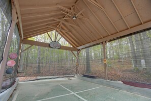 Enjoy hours of entertainment on your covered basketball court, located next to the house!