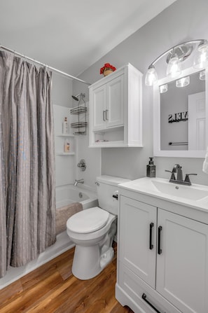 bathroom with tub and shower 