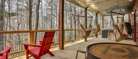 Terrace level seating, swinging chairs, and hot tub 