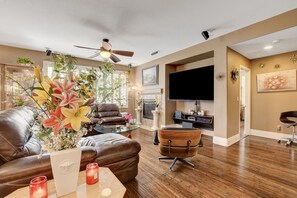 Great room: Plantation shutters and ceiling fan as added features