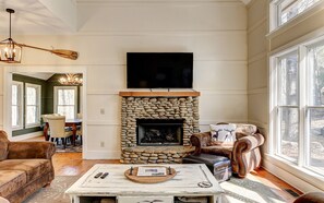 Cozy fireside retreat with forest views.