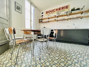 The kitchen/diner with integrated appliances and original encaustic tiled floor