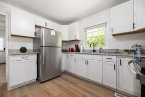 Kitchen has toaster, waffle maker, George Foreman Grill, Stove, Microwave & all cooking utensils needed