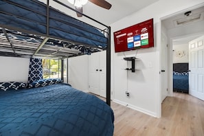 Bedroom 2 w/ Twin XL over Queen Bunk Bed. 4k Roku TV w/ Bluray player. In closet is Pack-n-Play & Highchair as needed.