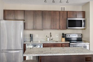 Large countertops and elegant cabinetry make cooking a joy