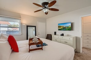Relax in our master bedroom featuring a premium King, HDTV with streaming network & cable channels from Youtube TV, full-length mirror, USB charging station, large walk-in closet, access to the patio, and more.