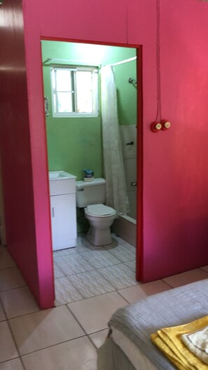 Ensuite bathroom to room one  