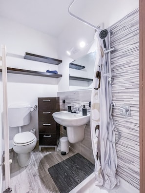 Bathroom with shower, without bidet