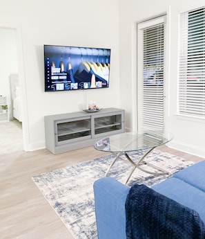 Living Room with 65" Smart TV, Cable and Sleeper Sofa