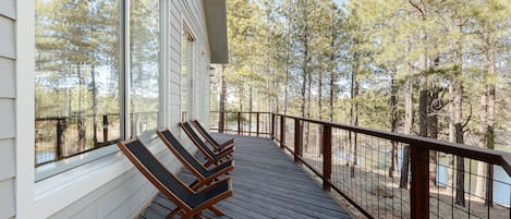 Serene wrap around deck overlooking the lake to slow down and unwind.