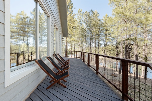 Serene wrap around deck overlooking the lake to slow down and unwind.