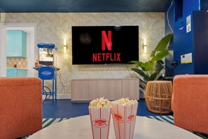 Grab some popcorn, it's movie night in the theater room on the 85" TV!