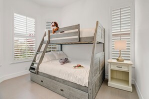 Bunk bed with twin on top, full bed on bottom and twin in trundle