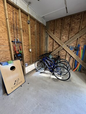 Bicycles, fishing poles, ping pong, beach toys, bags