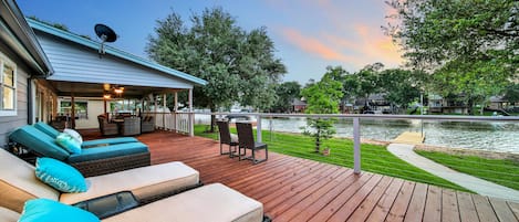 Your view of the lawn, waterfront & 30' pier while relaxing on the 1200 sf. deck