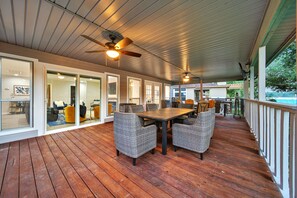 The covered area w fans, TV and dining  area. Ample room, outside of living area