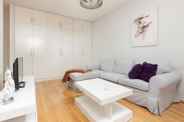 Relax in the stylish living room with a comfortable sofa and stylish decor.